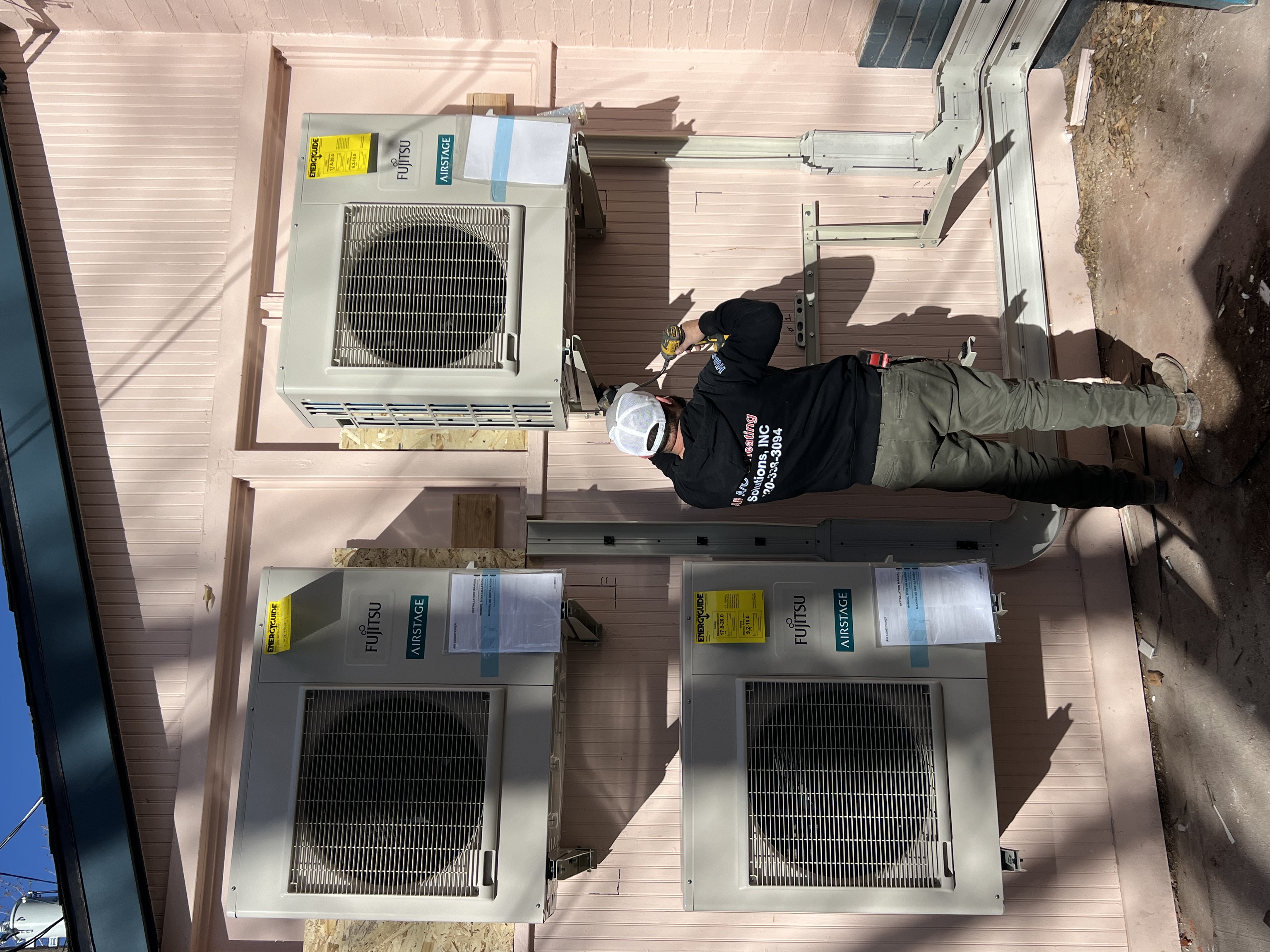 HVAC technician working on a system